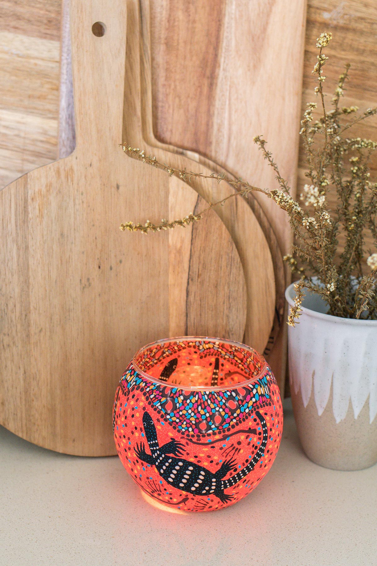 Perentie tea light candle holder with lit candle